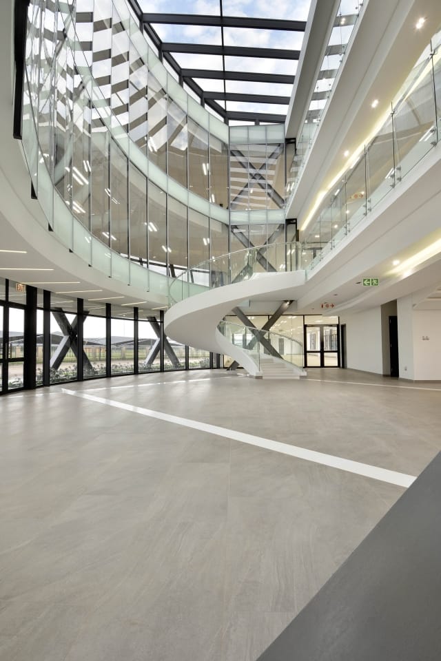 The atrium and spiral staircase at Clearwater Office Park, a Blu Real Estate commercial listing
